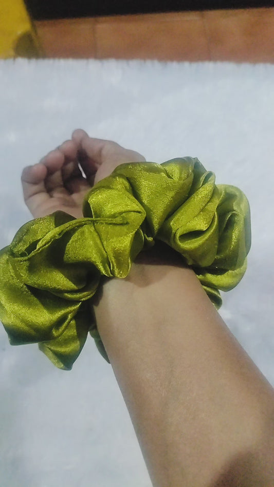 A beautiful Olive Green Satin Scrunchie 🌿✨.